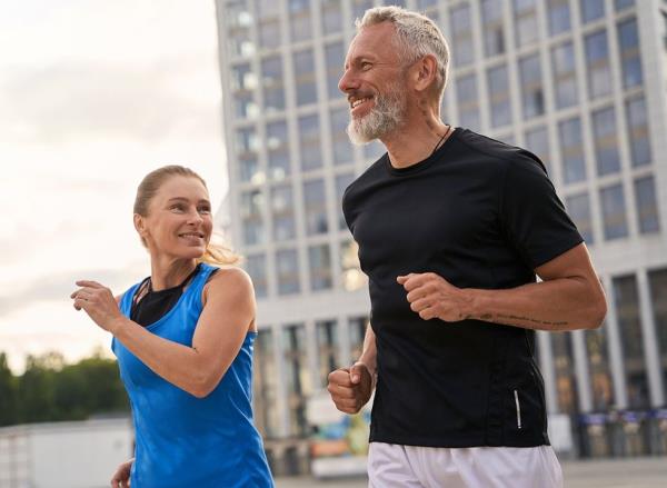 A middle-aged couple running together