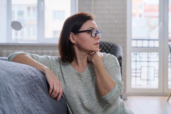 mature woman sitting on the floor at home