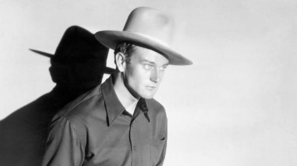 young John Wayne as a cowboy