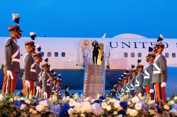 Vice President Kamala Harris waves upon arrival at the Aeropuerto Internacional La Aurora in Guatemala City on June 6, 2021