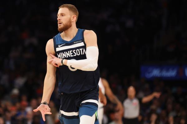 Donte DiVincenzo, Minnesota Timberwolves guard, celebrating after making a 3-point basket against the New York Knicks in a preseason NBA basketball game