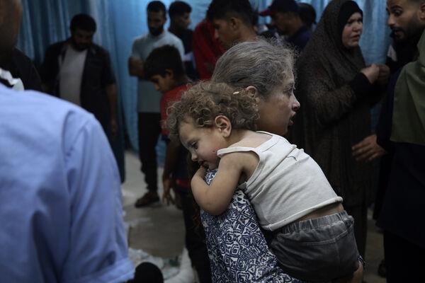 Palestinian children wounded in the Israeli bombardment of a residential building in Bureij refugee camp being brought to al-Aqsa Martyrs hospital in central Gaza on Tuesday. Photo: AP/Saher Alghorra Palestinian children wounded in the Israeli bombardment of a residential building in Bureij refugee camp being brought to al-Aqsa Martyrs hospital in central Gaza on Tuesday. Photo: AP/Saher Alghorra