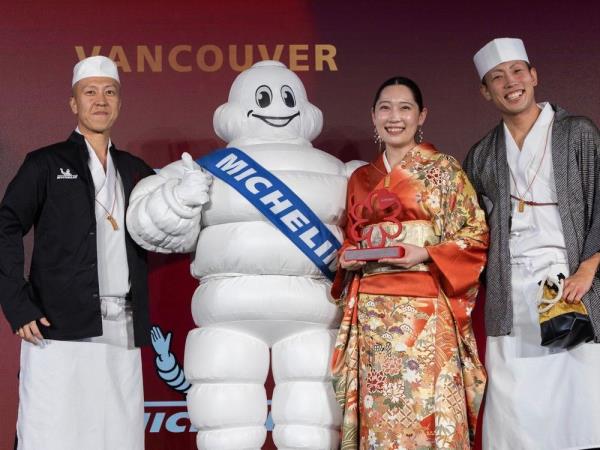 Chef Takuya Matsuda (left) of Okeya Kyujiro earns a Michelin Star during Michelin Star awards at the Fairmont Pacific Rim in Vancouver Oct. 5, 2023.