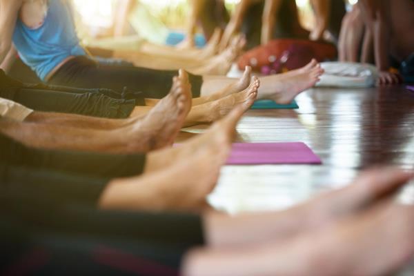 A group of women practising yoga.