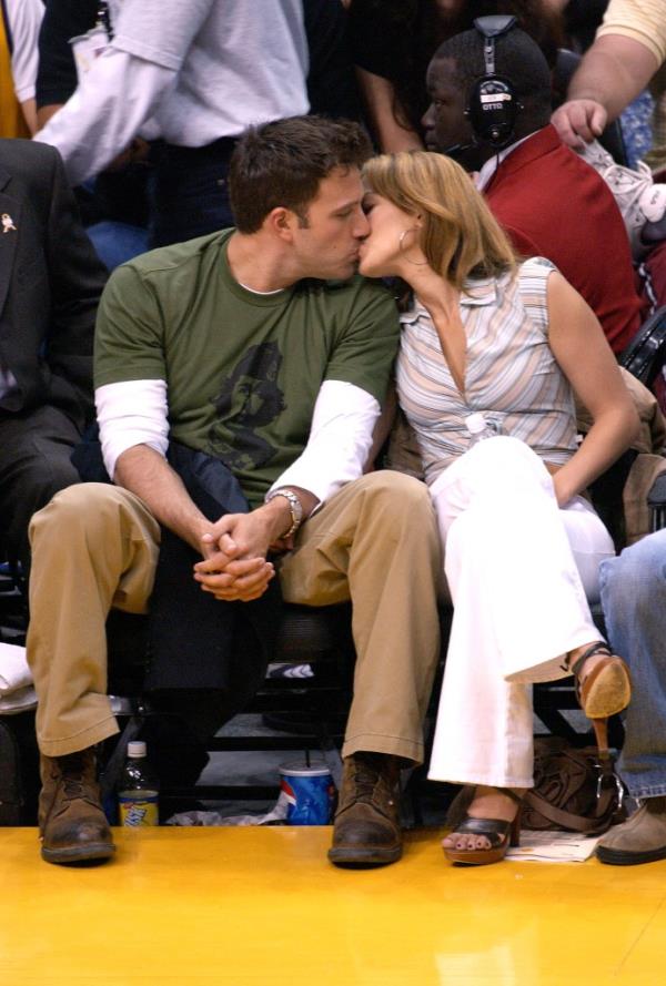 The pair kiss at the Los Angeles Lakers game on May 11, 2003.