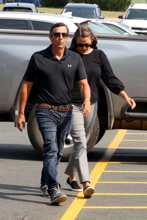 Bergman walking into court with her father.