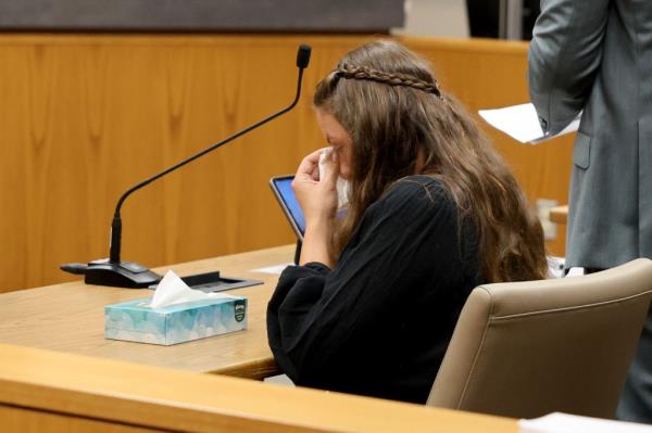 Bergman wiping away tears while in court.