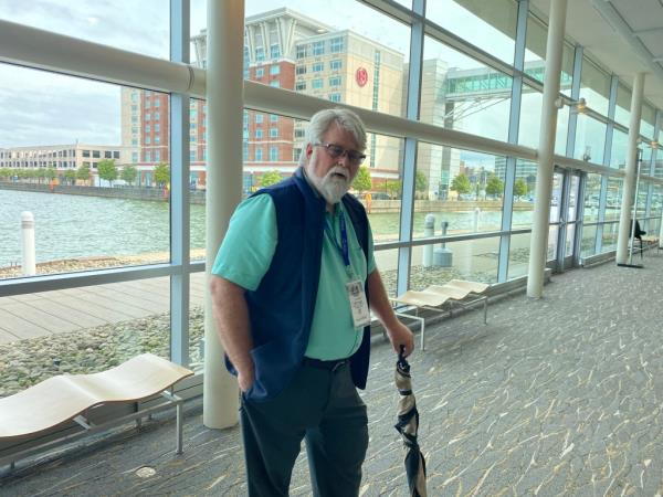 Jim Milleson leans on his umbrella at the Shale Insight Conference in Erie, Pennsylvania.