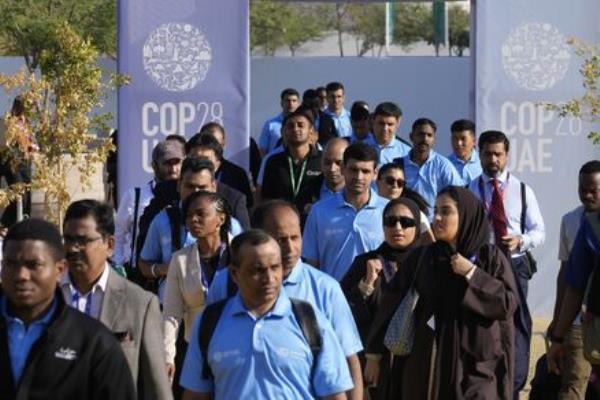 People walk through the venue at the COP28 U.N. Climate Summit on Friday, in Dubai, United Arab Emirates. (Picture: AP Photo/Rafiq Maqbool) People walk through the venue at the COP28 U.N. Climate Summit on Friday, in Dubai, United Arab Emirates. (Picture: AP Photo/Rafiq Maqbool)