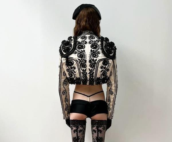 Models walking the runway at Paris Fashion Week, showcasing a pearl-encrusted G-string fashion trend.