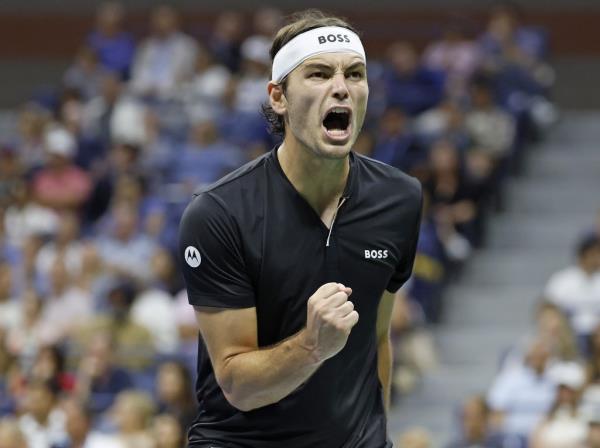 Taylor Fritz celebrates after winning a point during his five-set U.S. Open semifinal win over Frances Tiafoe on Sept. 6, 2024.