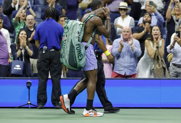 A completely dejected Frances Tiafoe walks off the court after his five-set US. Open semifinal loss.