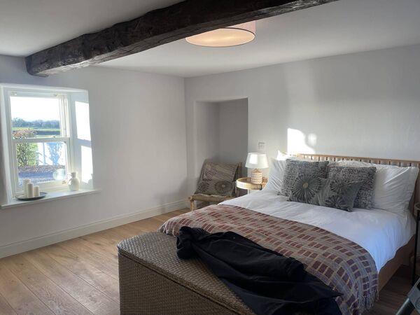 The bedroom with original beam. The bedroom with original beam.