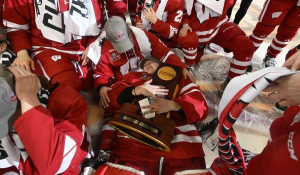 Cami Kronish hugs the national championship trophy after winning the 2023 NCAA Tournament.