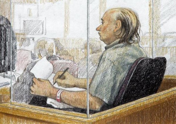 This artist's sketch shows accused serial killer Robert Pickton taking notes during the second day of his trial in B.C. Supreme Court in New Westminster, British Columbia, Jan. 31, 2006. Convicted Canadian serial killer Pickton has been hospitalized and is in a life-threatening condition after an assault at a Quebec prison, authorities said Tuesday, May 21, 2024. (Jane Wolsack/The Canadian Press via AP)