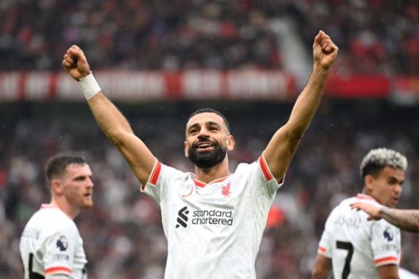 Mohamed Salah of Liverpool celebrates scoring his team's third goal during the Premier League match between Manchester United FC and Liverpool FC at Old Trafford 