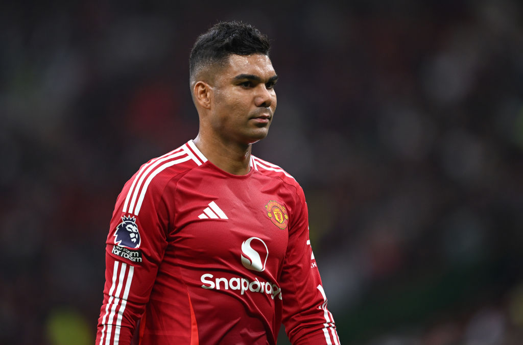Casemiro of Manchester United looks dejected, as they walk off for half time during the Premier League match between Manchester United FC and Liverpool