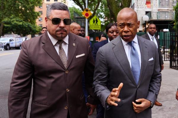 New York City Mayor Eric Adams, right, and New York City Police Commissioner Edward Caban arrive for the funeral of NYPD officer Edgar Ordonez at St. Anselms Roman Catholic Church on Thursday, July 18, 2024 in The Bronx, N.Y.