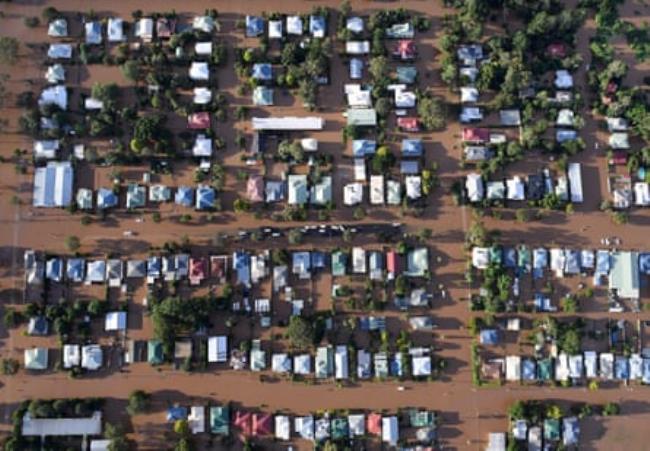 An aerial photograph of flood waters engulfing housing in central Lismore, New South Wales, Friday, 31 March 2017.