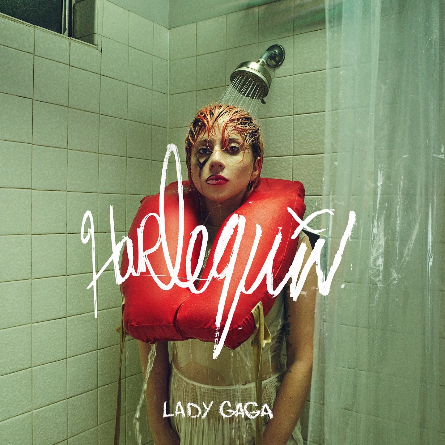 Harlequin album artwork shows gaga with life jacket around neck. She stands soaking wet in tiled room.