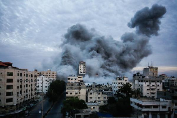 Smoke and flames billow after Israeli forces struck a high-rise tower in Gaza City