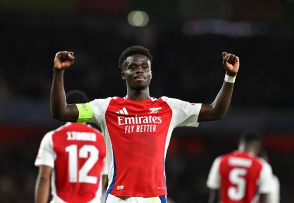 Bukayo Saka of Arsenal celebrates scoring his team's second goal during the UEFA Champions League 2024/25 League Phase MD2 match between Arsenal FC and Paris Saint-Germain