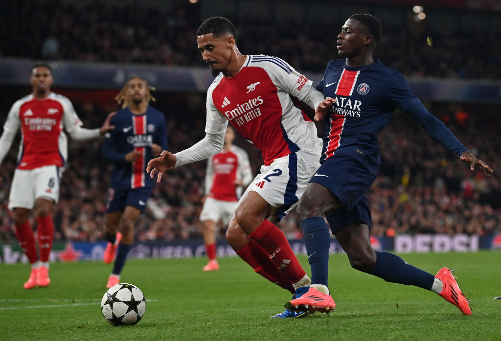 Arsenal's French defender #02 William Saliba (L) defends from Paris Saint-Germain's Portuguese defender #25 Nuno Mendes during the UEFA Champions League football match between Arsenal and Paris Saint-Germain