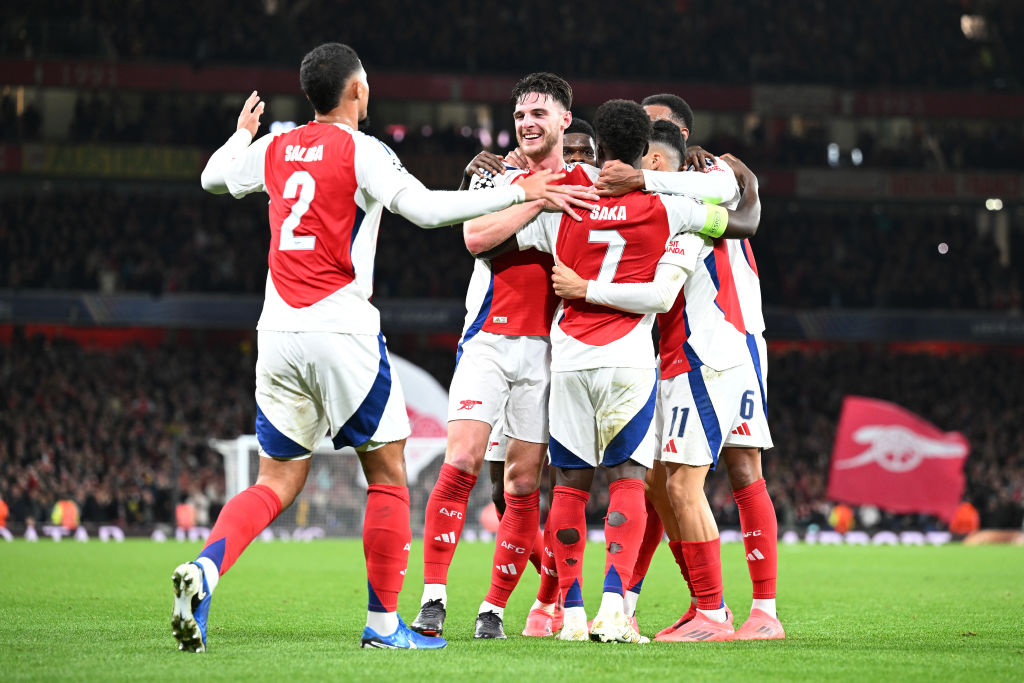 Bukayo Saka of Arsenal celebrates with teammates after scoring his team's second goal during the UEFA Champions League 2024/25 League Phase MD2 match between Arsenal FC and Paris Saint-Germain