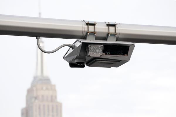 A general view of a congestion pricing toll gantry with the Empire State Building behind it as seen on W40th Street in New York, NY on June 5, 2024.