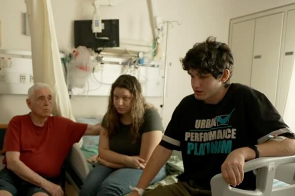 Rotem Mathias, 16, seen with his sister and their grandfather in the hospital