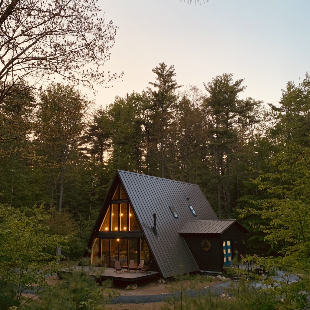 Black ADK Aframe in Adirondacks at sunset.