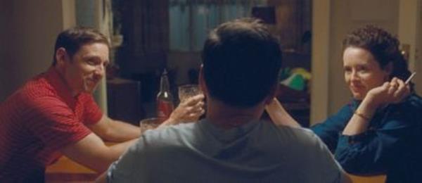 Jamie Bell, Andrew Scott (from behind) and Claire Foy in ‘All of Us Strangers’.