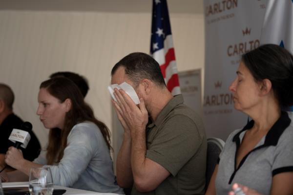 Nahal Neta, son of 66-year-old Adrienne Neta, fought back tears
