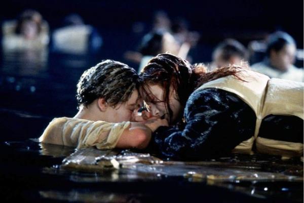 Leonardo DiCaprio and Kate Winslet as Jack and Rose in Titanic floating in the ocean on the door