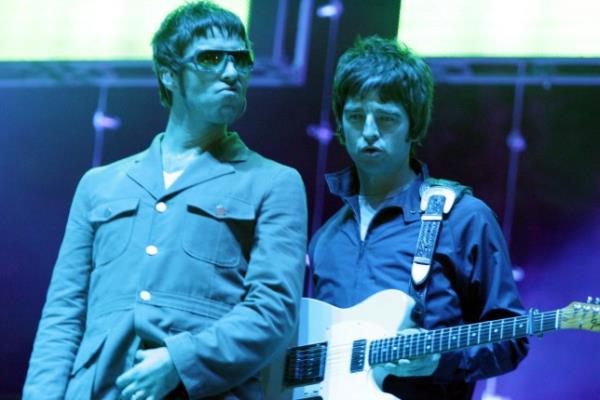 Oasis perform together on stage 