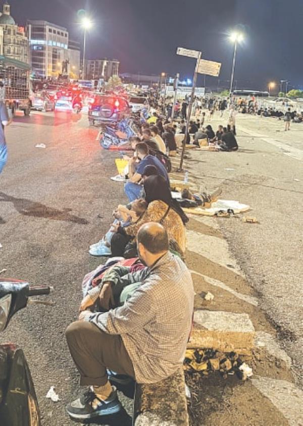  DISPLACED people gather at Beirut’s Martyrs’ Square on Saturday as Israel strikes the city’s southern suburbs.—Reuters 