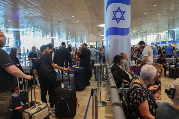 Passengers wait for flights at the Ben Gurion airport in Tel Aviv during a nationwide strike
