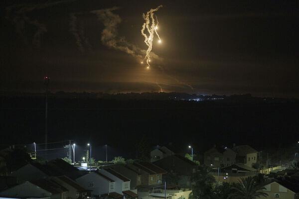 Flares rise over the Gaza Strip, as seen from southern Israel, Wednesday, Nov. 15, 2023. (AP Photo/Leo Correa) Flares rise over the Gaza Strip, as seen from southern Israel, Wednesday, Nov. 15, 2023. (AP Photo/Leo Correa)