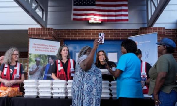 People line up to distribute food at community center