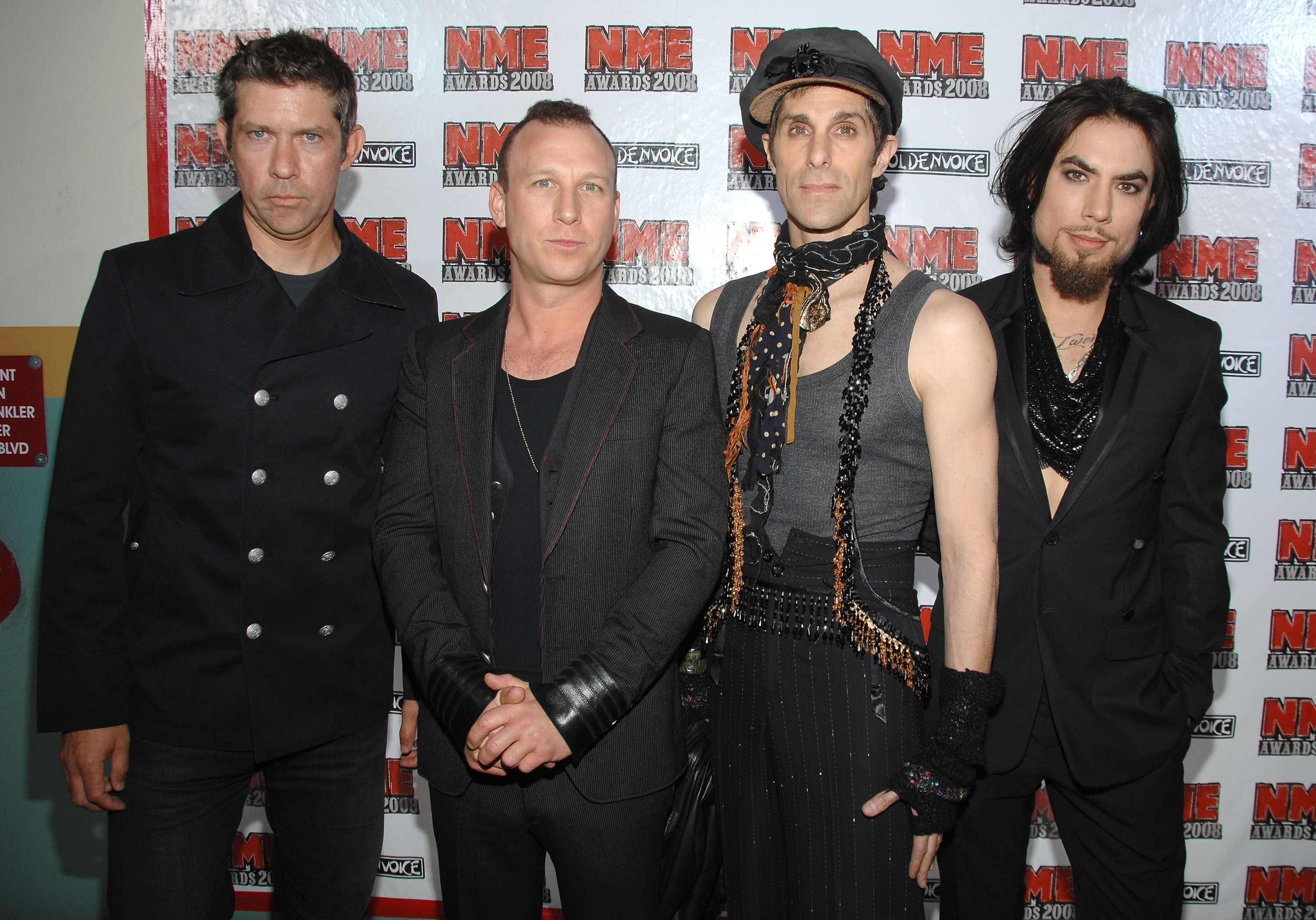 Jane's Addiction members Eric Avery, Stephen Perkins, Perry Farrell and Dave Navarro stand next to each other at the 2008 NME Awards