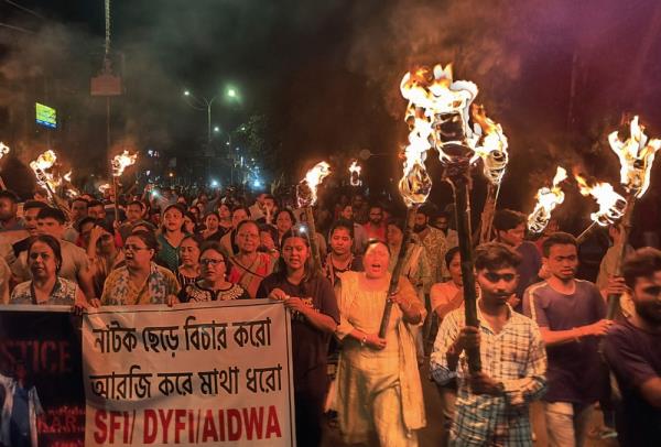 Medical professionals, activists and citizens of Siliguri chant as they take part in a protest march named 'The Night is also ours' to condemn the rape and murder of a young medic, in Siliguri on August 14, 2024.
