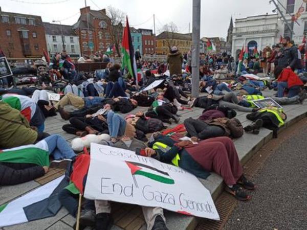 Protestors lie down in Cork calling for an end to the Israeli bombardment of Gaza.