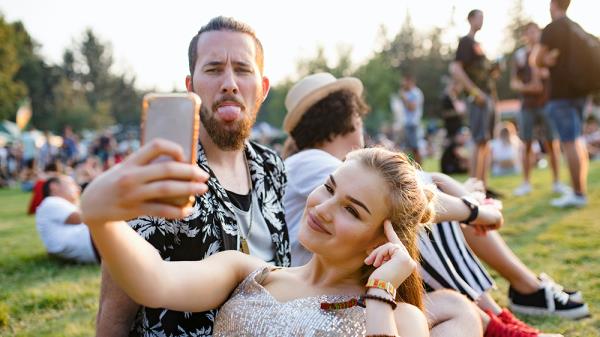 A man and a woman taking a selfie. Photo. 