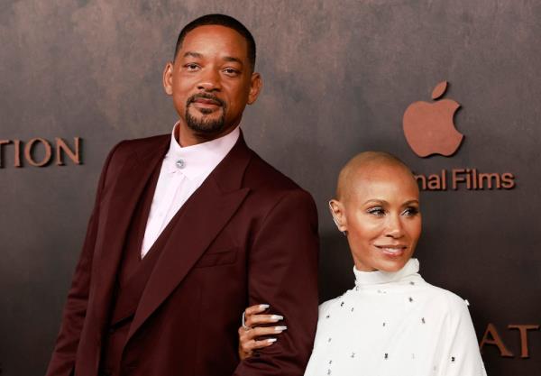 Smith is seen left with wife Jada Pinkett Smith while promoting the film in Los Angeles in November 2022.