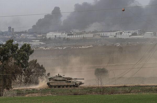 An Israeli army tank moves near the Gaza Strip border, in southern Israel on Saturday (Picture: AP Photo/Tsafrir Abayov) An Israeli army tank moves near the Gaza Strip border, in southern Israel on Saturday (Picture: AP Photo/Tsafrir Abayov)