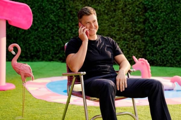 Colin Jost on a pink phone on "SNL."