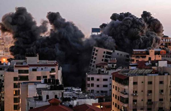 Smoke billows from an Israeli air strike on the Hanadi compound in Gaza City, controlled by the Palestinian Hamas movement