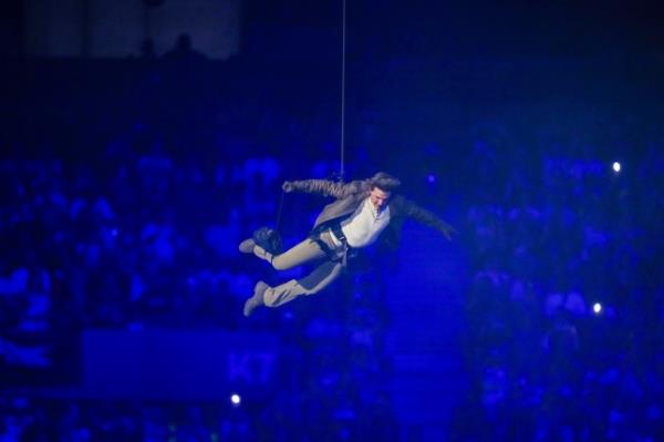 Tom Cruise is lowered on the State de France during the 2024 Summer Olympics closing ceremony.