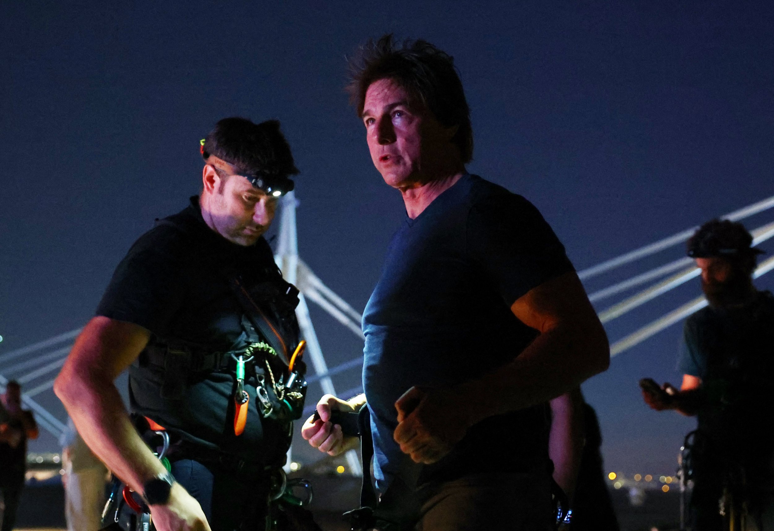 Tom Cruise is lowered on the State de France during the 2024 Summer Olympics closing ceremony.