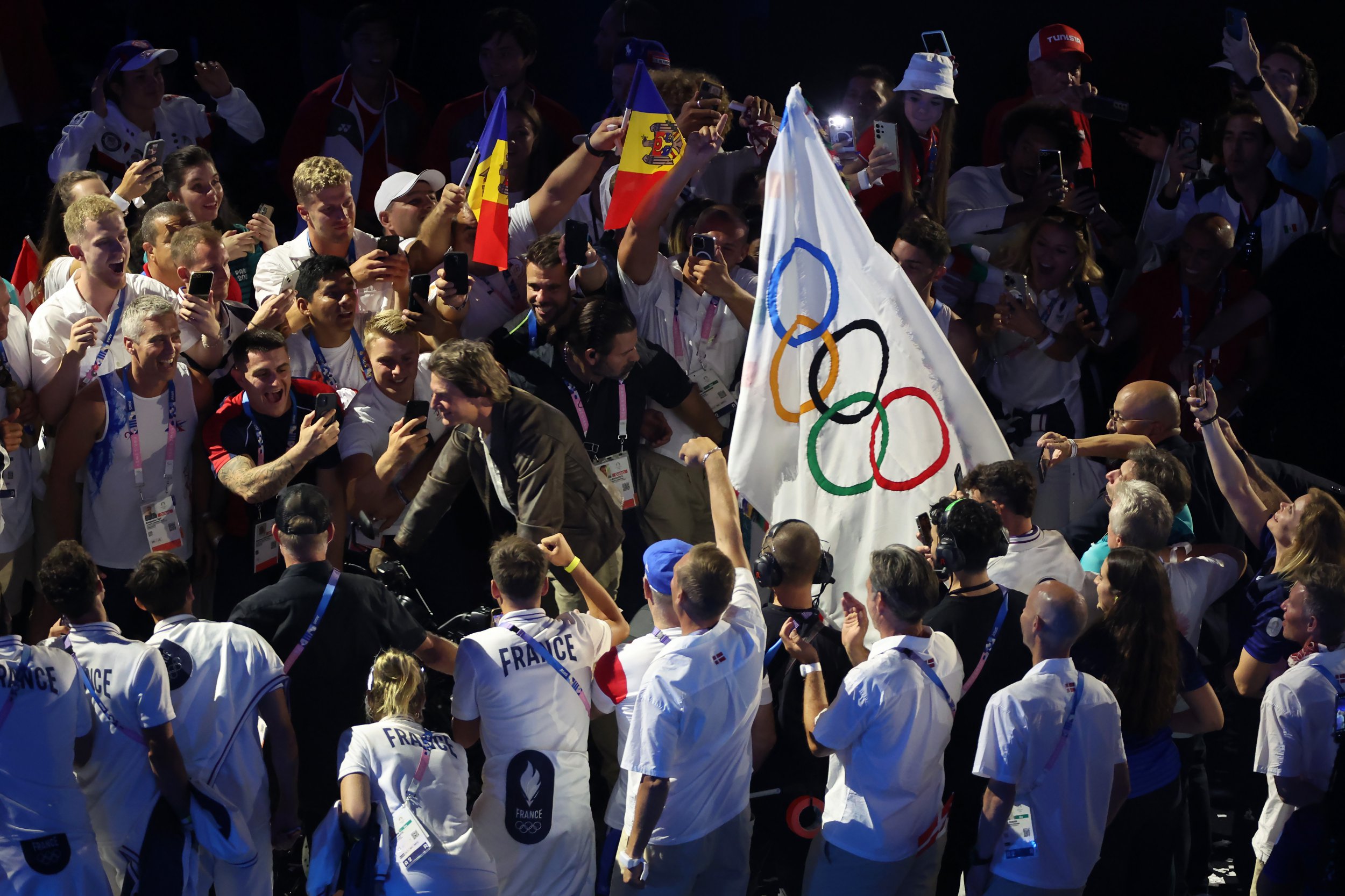 Tom Cruise on a motorbike in State de France during the 2024 Summer Olympics closing ceremony.